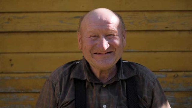 Older man smiling to camera